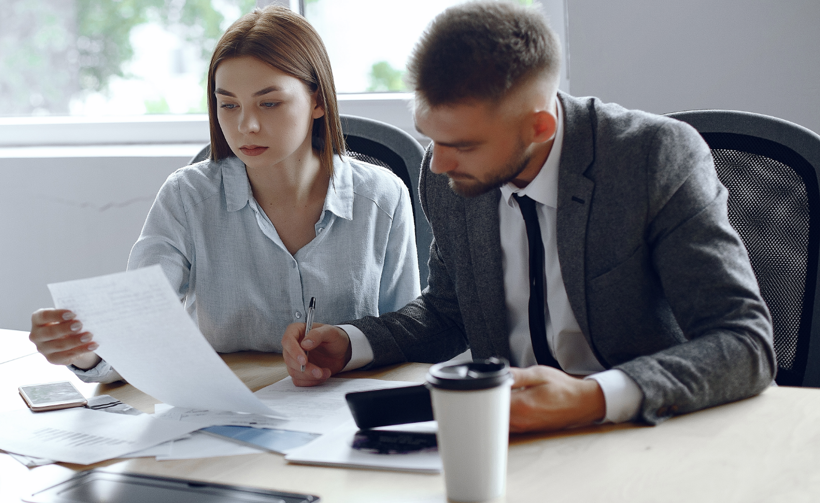 People on office completing paper work