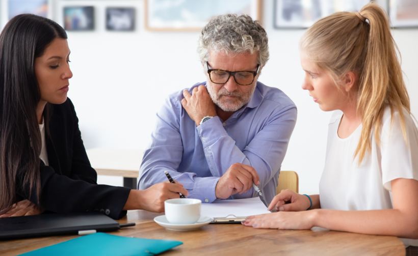 Office workers looking over documents